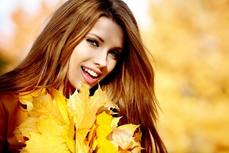 confident-woman-smiling-fall-background